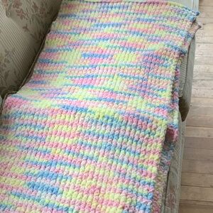 White handmade, multicolored, vibrant, soft, comfortable blanket